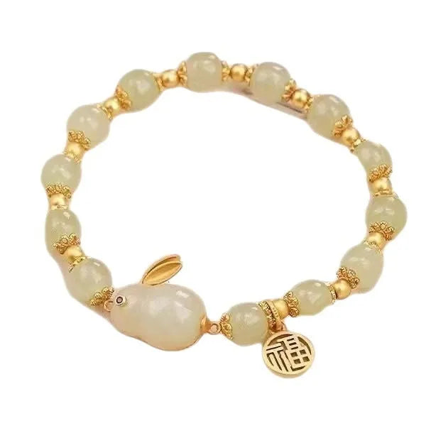 Green mixed-material jade hare bracelet with electroplated finish and lily decorative elements