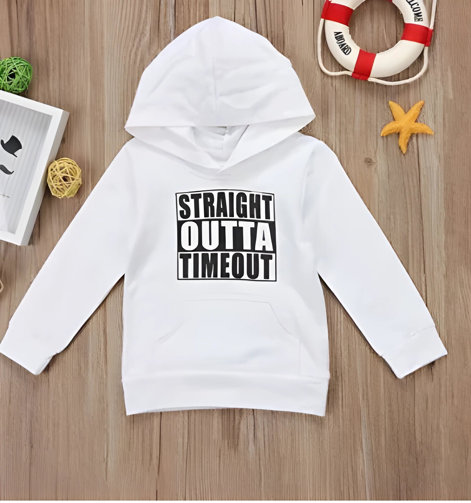 Black children's hooded sweater with white letter pattern, long sleeves, and a pullover neck.