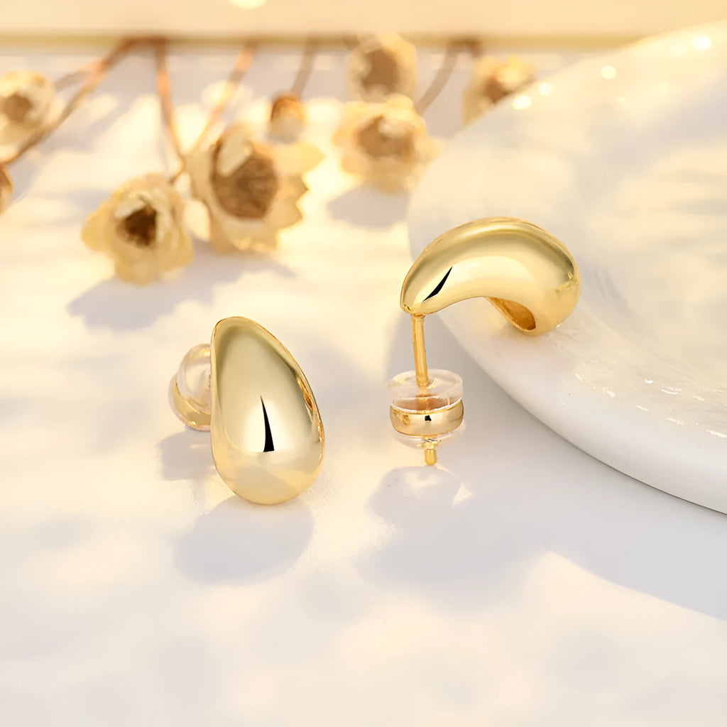 Minimalistic water drop earrings real gold plated copper yellow gold finish on model