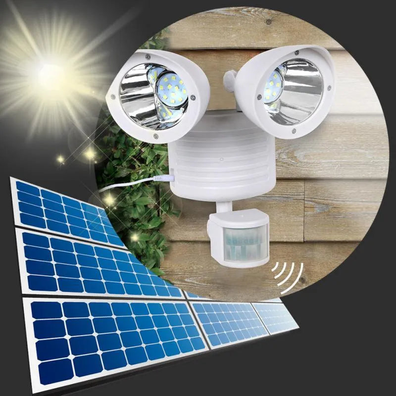 Black dual-head solar security spotlight with motion sensor mounted on exterior wall