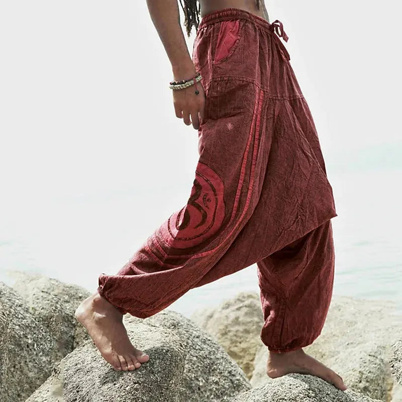 Men's dark green ethnic pattern trousers with ankle-tied design on mid waist