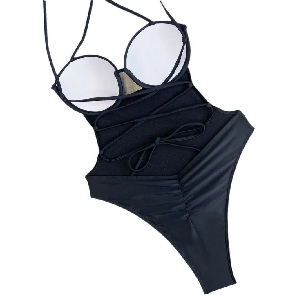 Black solid colour one-piece swimsuit for women on a hanger.