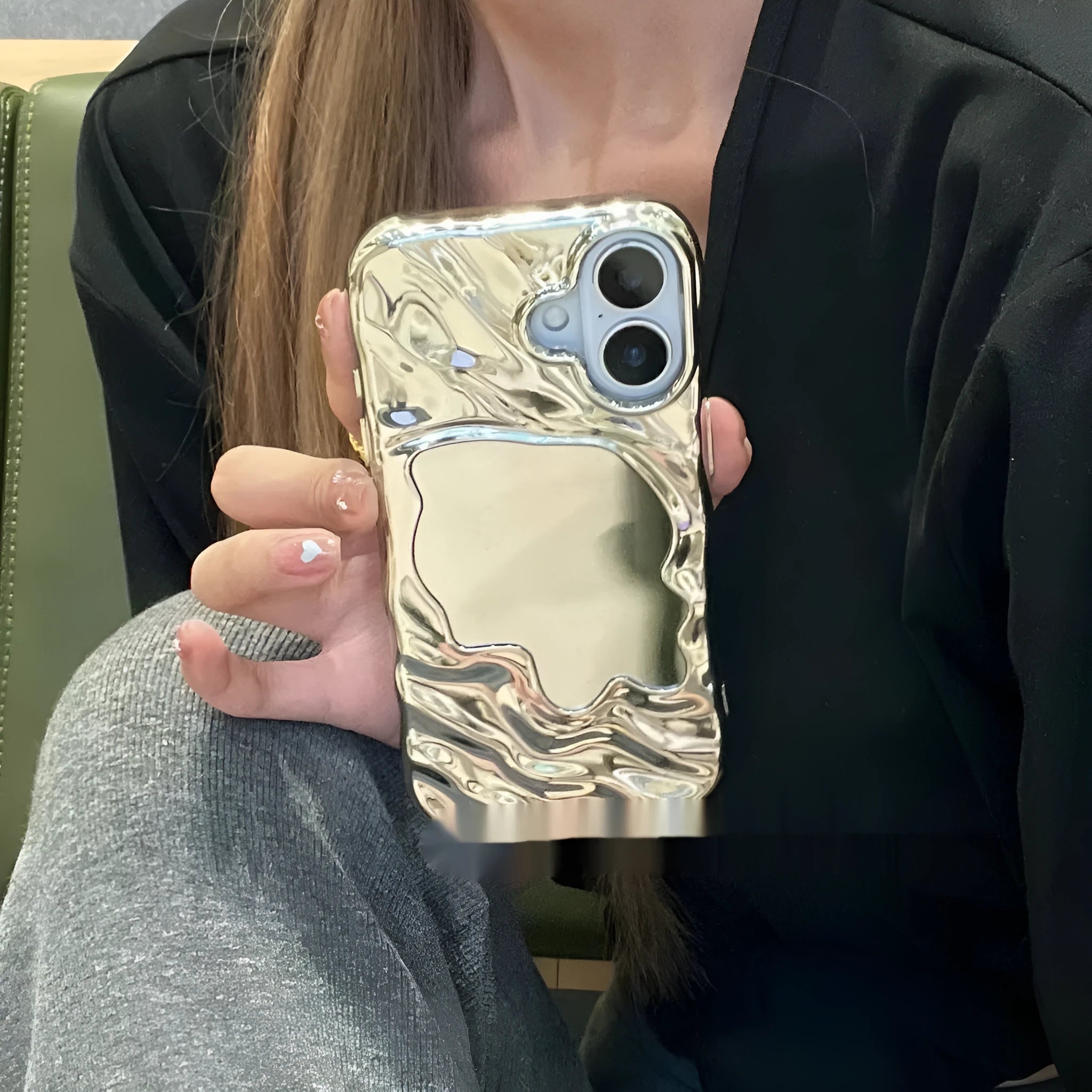 iPhone phone case with water ripple texture and a solid colour mirror back on a table