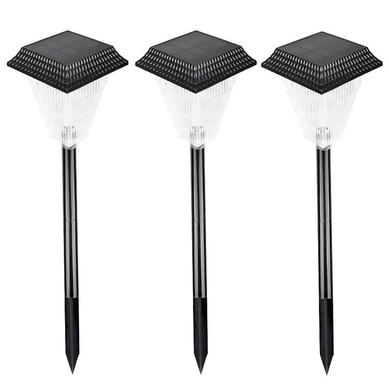 Solar garden light with LED bulbs in decorative outdoor setting showing colour options