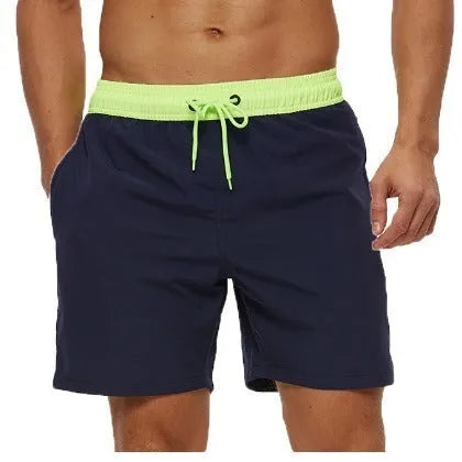 Men's blue running shorts with drawstring waist, stitching detail, and a headband pocket.