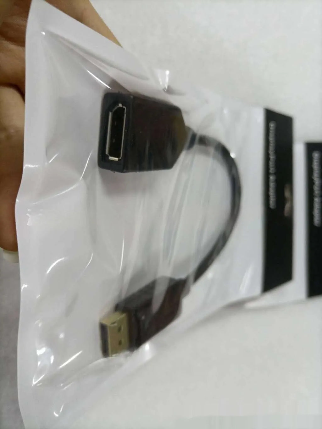 Black DisplayPort DP male to female extension cable with rotating busbar, approximately 10cm long