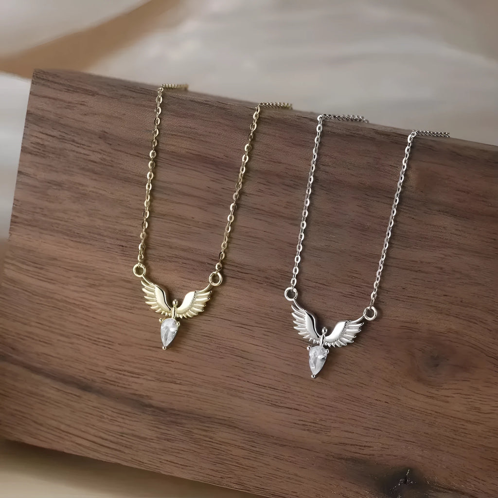 Close-up of a women's silver necklace with an eagle pendant on an adjustable O-ring chain.