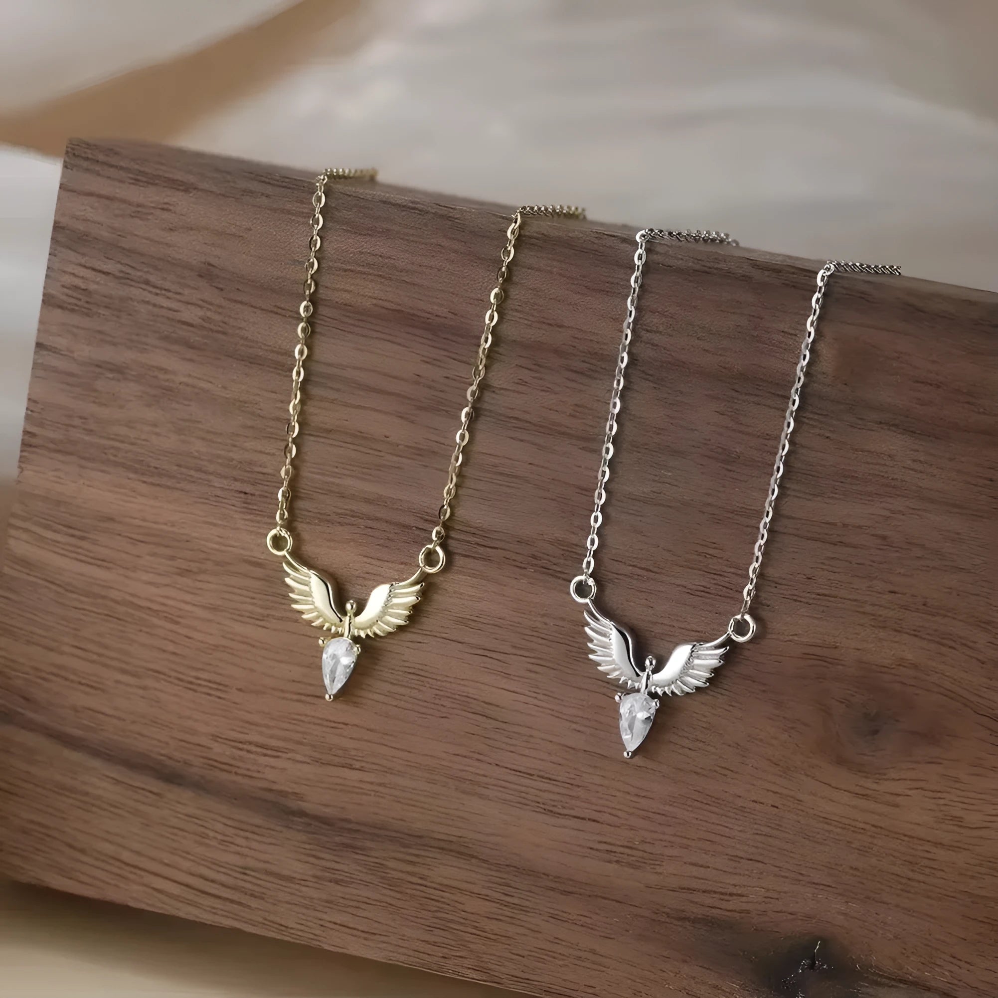 Close-up of a women's silver necklace with an eagle pendant on an adjustable O-ring chain.