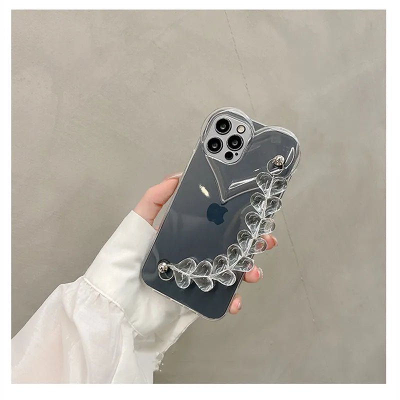 Transparent soft TPU iPhone case with a decorative silver love bracelet chain attached.