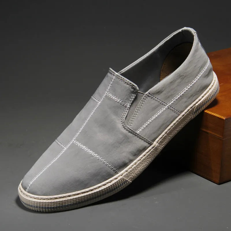 Men's low-top slip-on canvas shoes in khaki colour with round toe and vulcanised rubber sole.