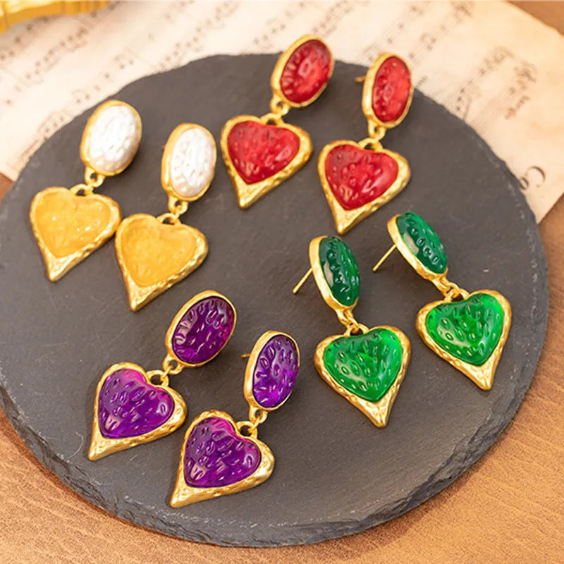 Pleated oval love heart stud earrings in alloy, showing purple, red, green, and yellow with white colour variations.