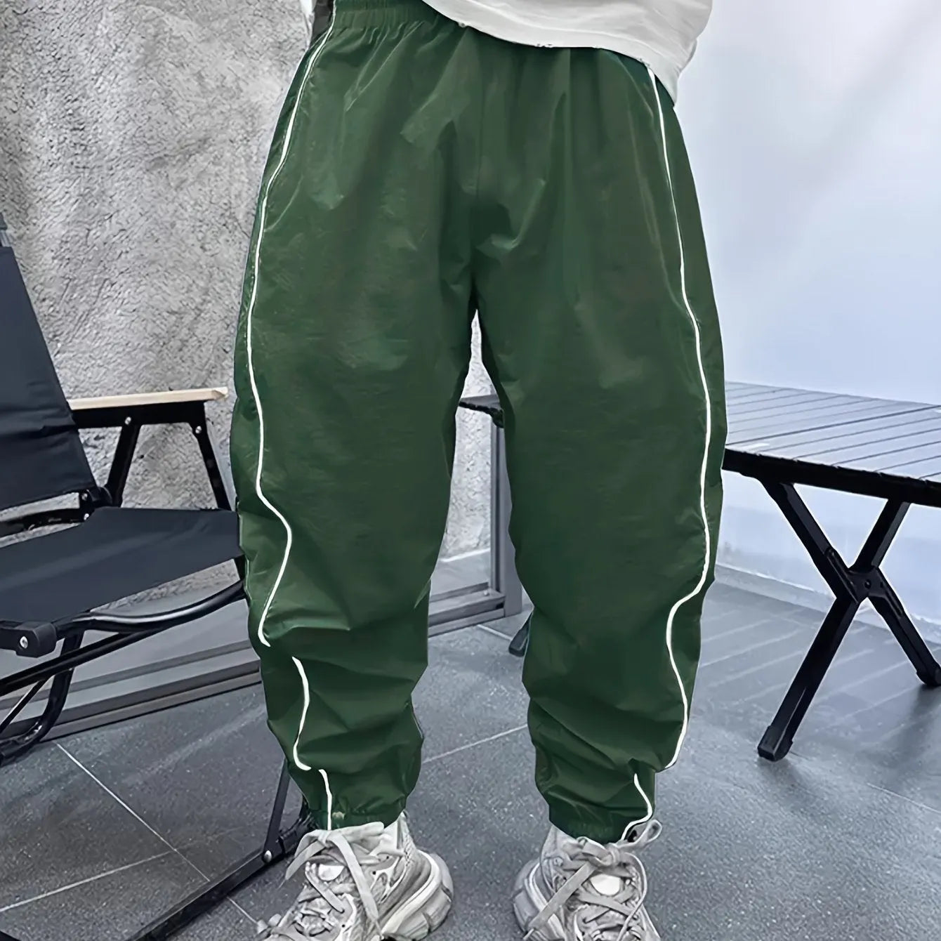 Men's blue bamboo fibre cropped casual sports trousers on a hanger.