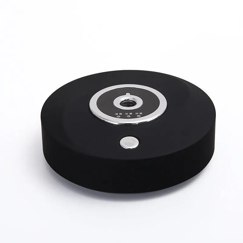 USB-powered car air freshener diffuser in black plastic housing with anti-slip pad.
