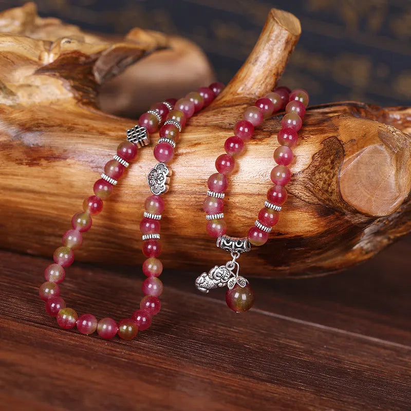 Watermelon crystal Chinese knot bracelet showing traditional design and natural crystal material