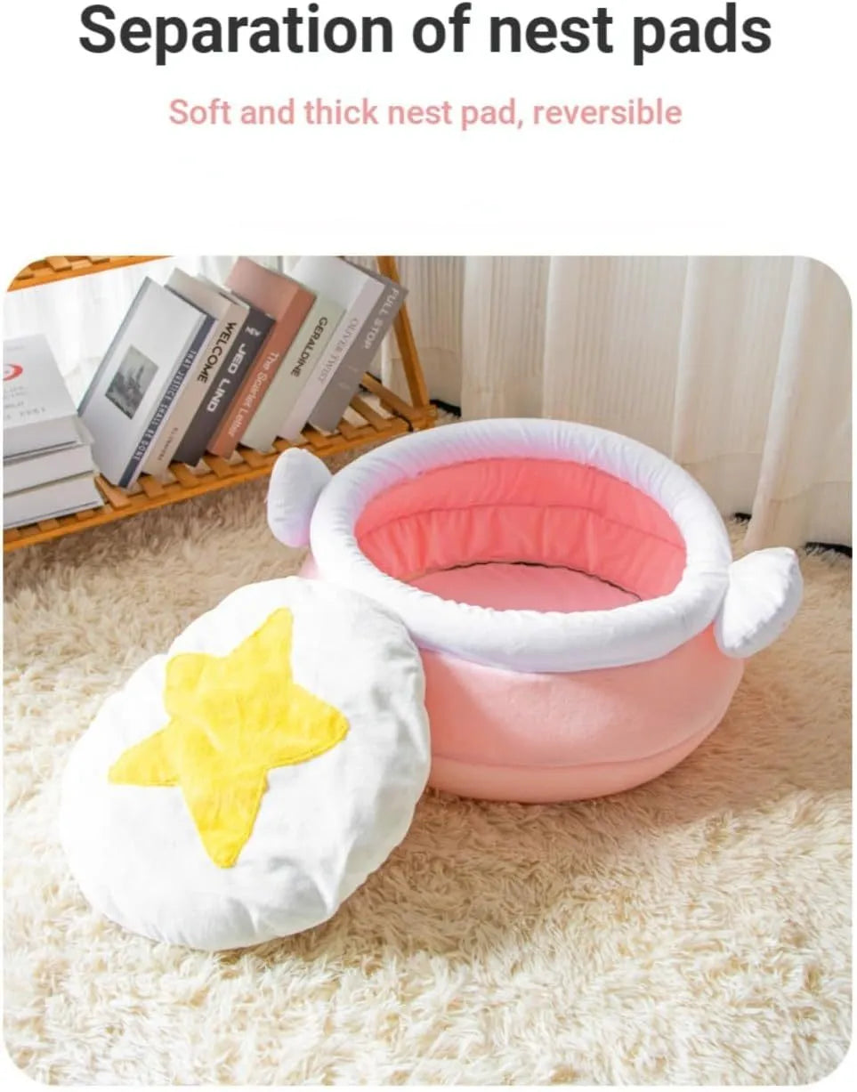 A pink magic honey pot shaped cat sofa bed with a soft interior for a small pet.