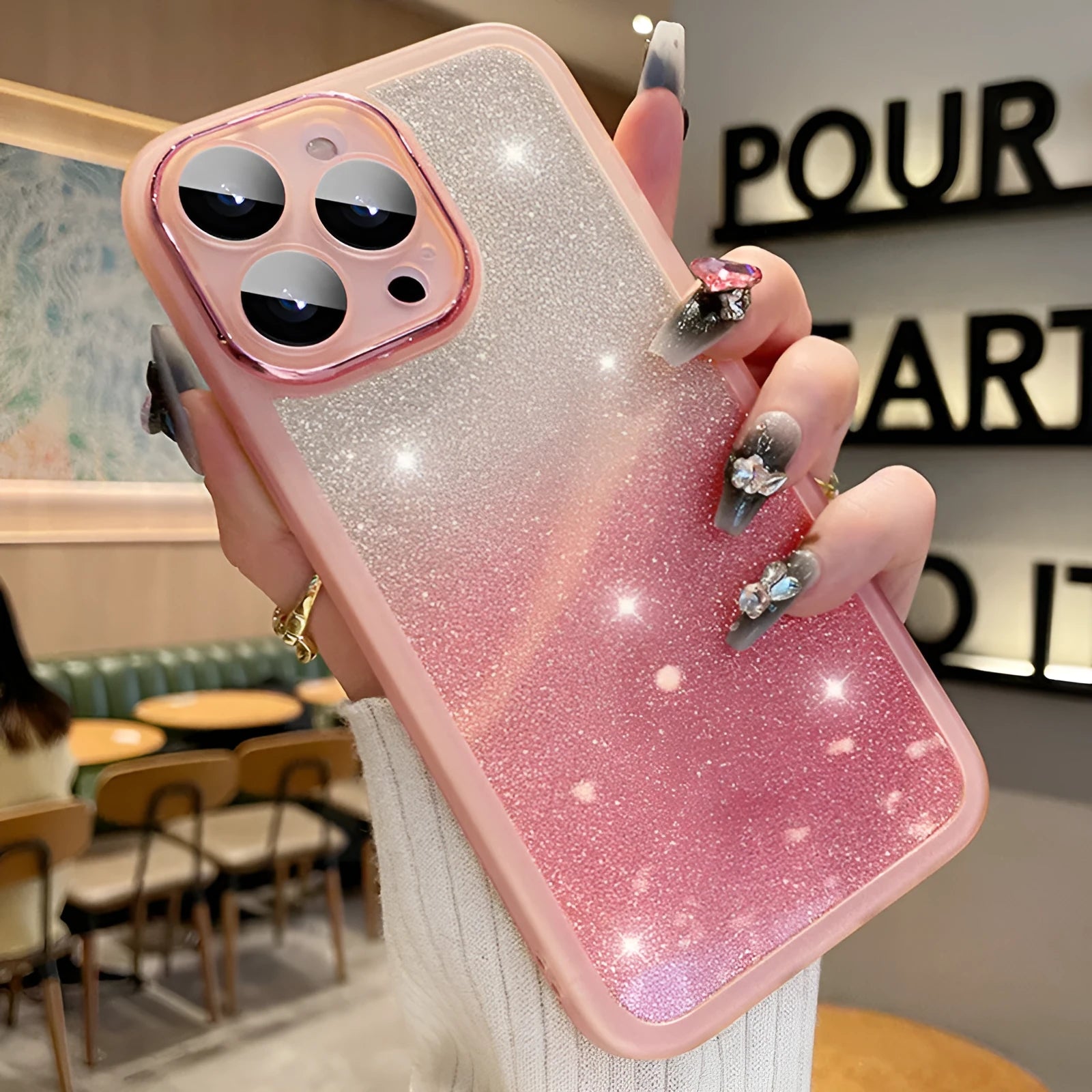 Transparent glitter gradient magnetic iPhone case for iPhone 15 Pro Max in pink and silver.