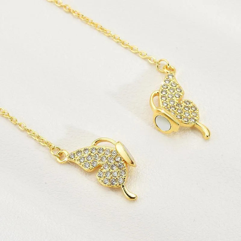 Women's magnetic snap butterfly necklace with twisted chain in gold or silver colour