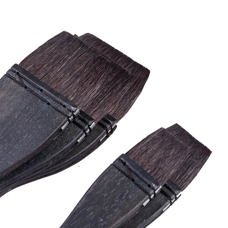 Grey squirrel hair makeup brush with wooden handle showing soft natural bristles