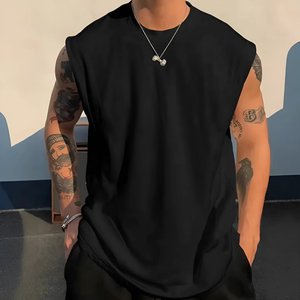Men's loose apricot-coloured cotton tank top on a hanger.