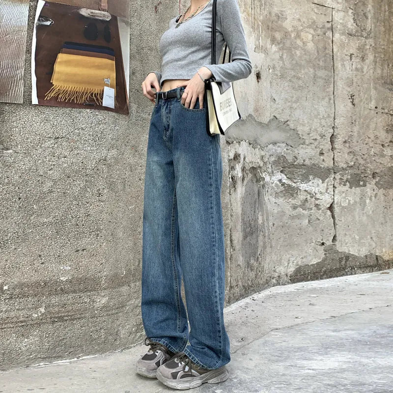 Women's high-waisted retro blue straight-leg jeans on a neutral background