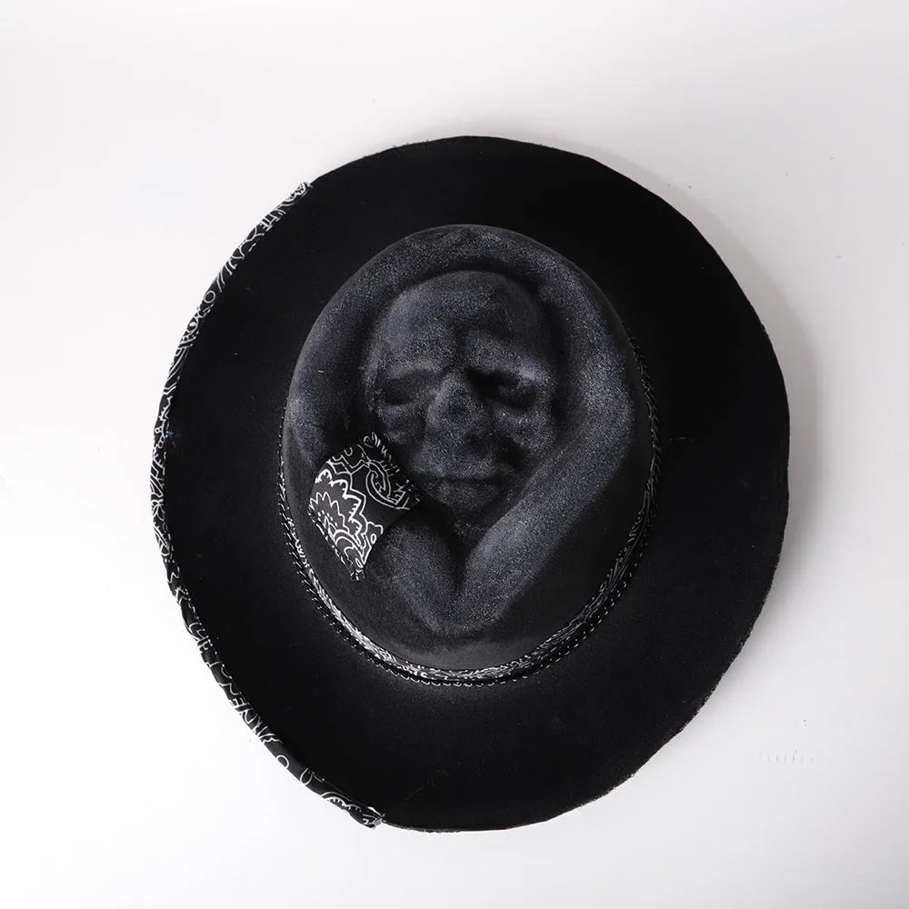 Handmade wool felt skull hat with a conical crown and blue denim trim.