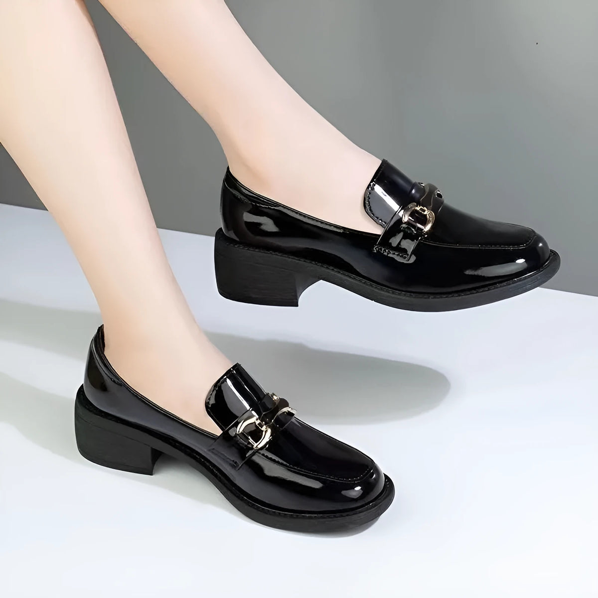 Dark green glossy women's loafers with chunky mid heel, metal buckle, and round toe, sizes 35-40.
