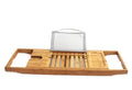 Natural bamboo single-tier desktop shelf for bathroom storage on a bathtub ledge.