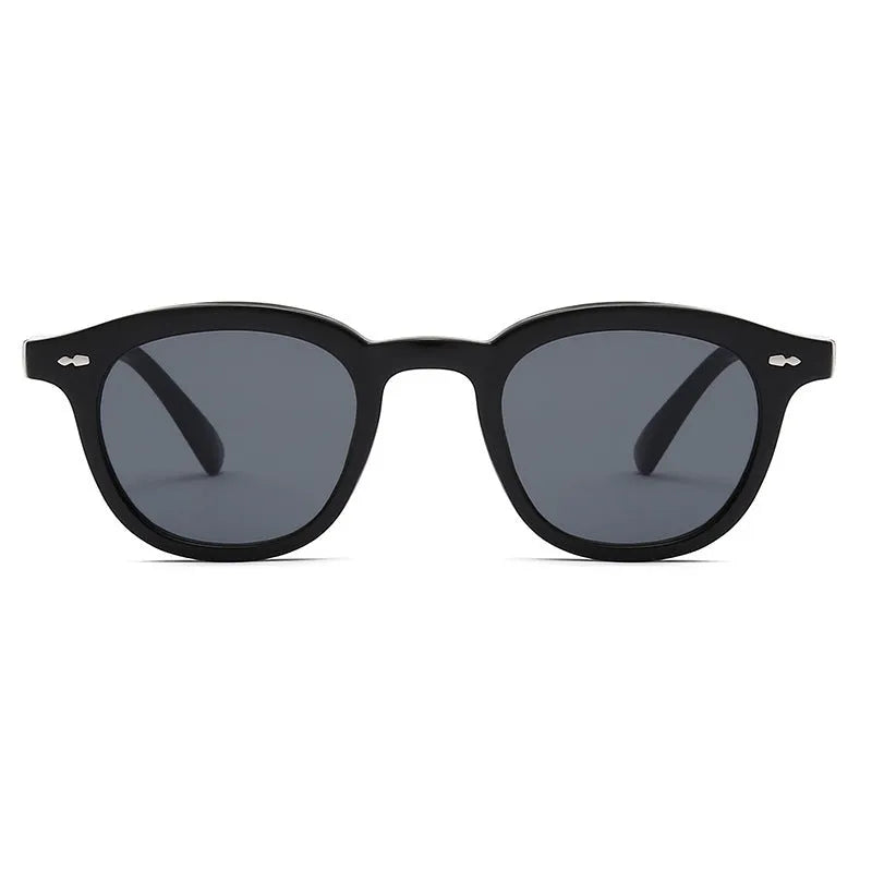 Round retro sunglasses with a metal hinge, shown in black frame with gradient tea lens option.