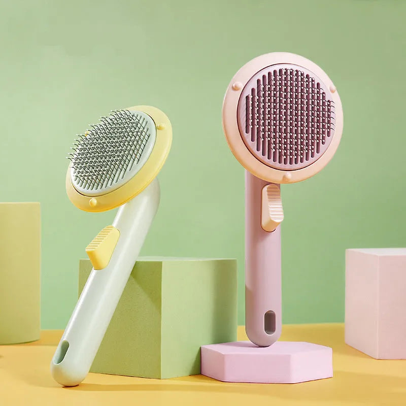 Pumpkin coloured pet grooming brush with curved stainless steel needles and a hand-held plastic handle.