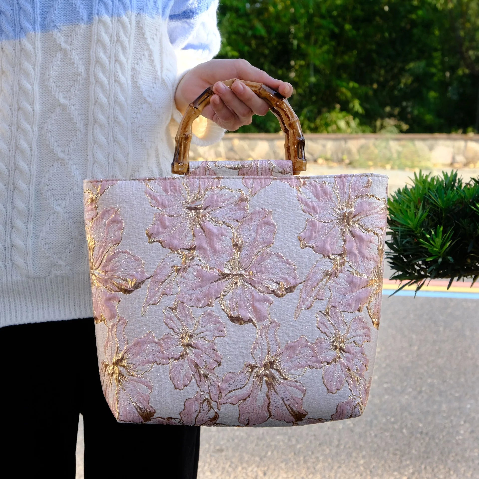 Light blue women's canvas shoulder bag with gold bronzing flower detailing showing horizontal square shape