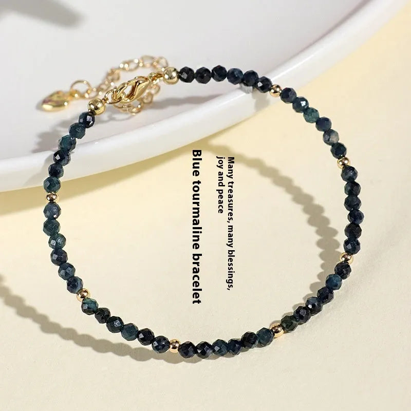 Blue tourmaline cut bead bracelet with 3mm faceted stones and spacer beads