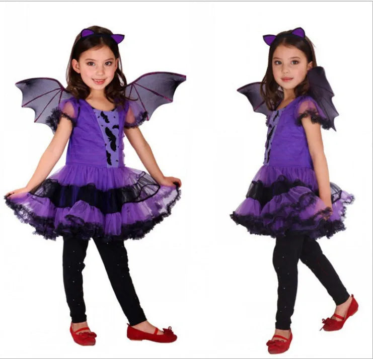 A child's witches costume for role play made from linen-blend fabric, shown on a hanger.