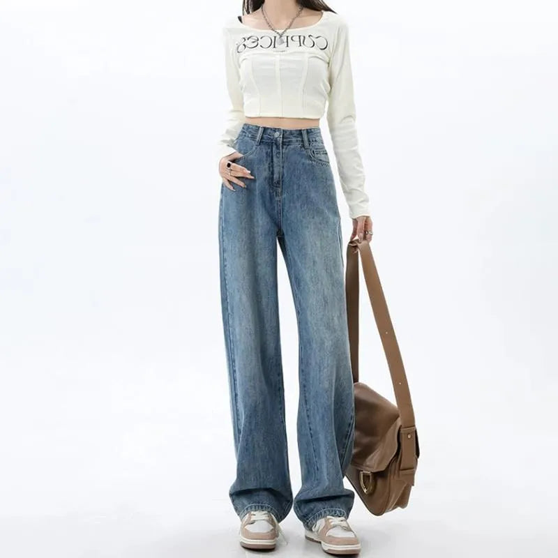 Retro blue high-waist wide leg jeans on a hanger showing straight leg trouser cut.