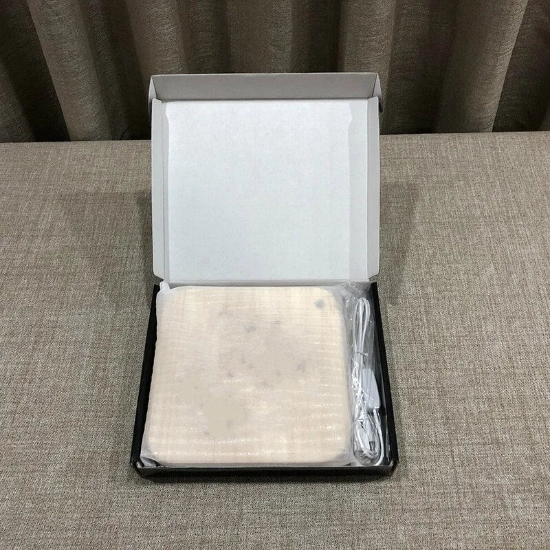Square pine wood USB-powered LED lamp emitting warm white 3D light on a table.