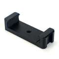 Silver aluminium alloy handheld phone mounting bracket for table top tripods, shown next to an iPhone.