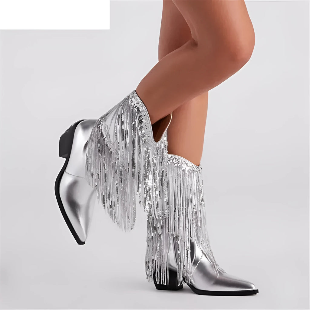 Women's black chunky heel ankle boots with tassel detail and a high stiletto heel on a plain background.