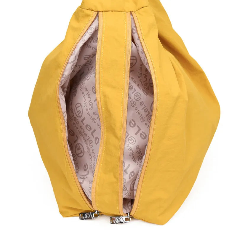 Women's heart-shaped nylon underarm bag in black, yellow, khaki, or blue colours showing large capacity design