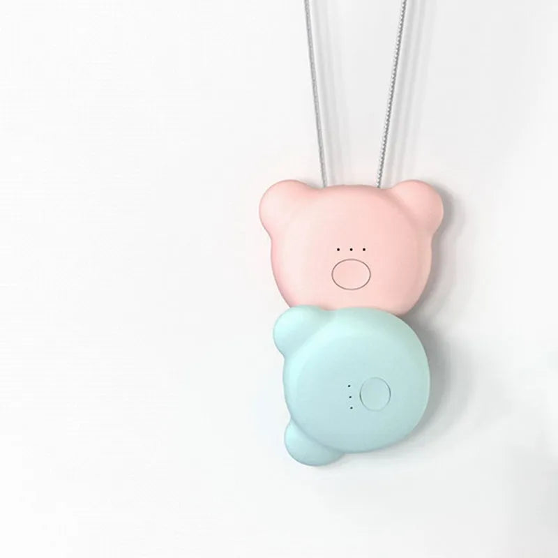 Mini USB rechargeable air purifier necklace in blue, shown with charging cable.