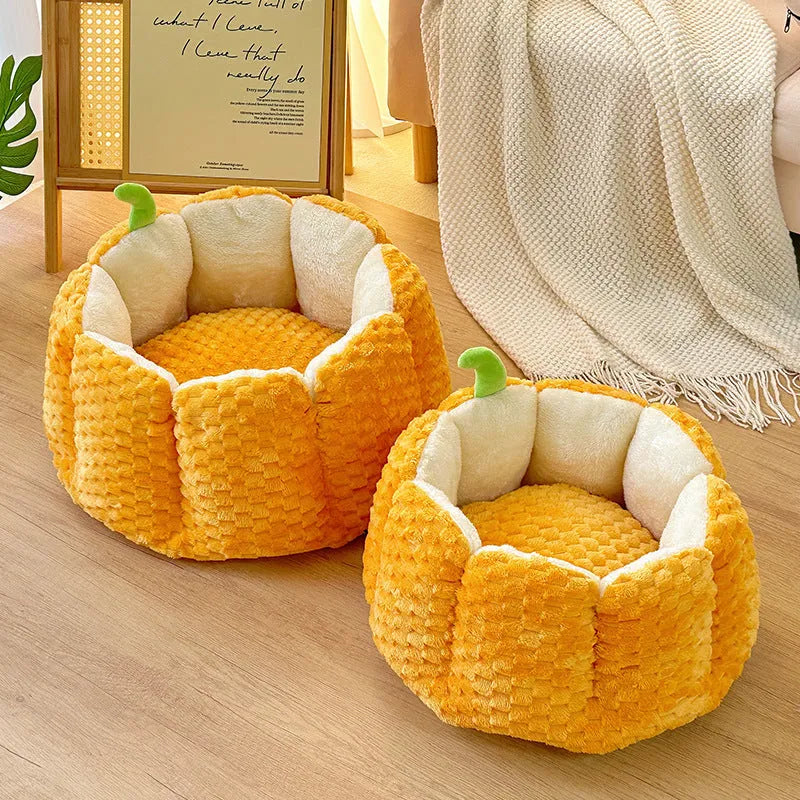 Orange pumpkin-shaped pet bed for cats and small dogs with raised sides and cotton filling