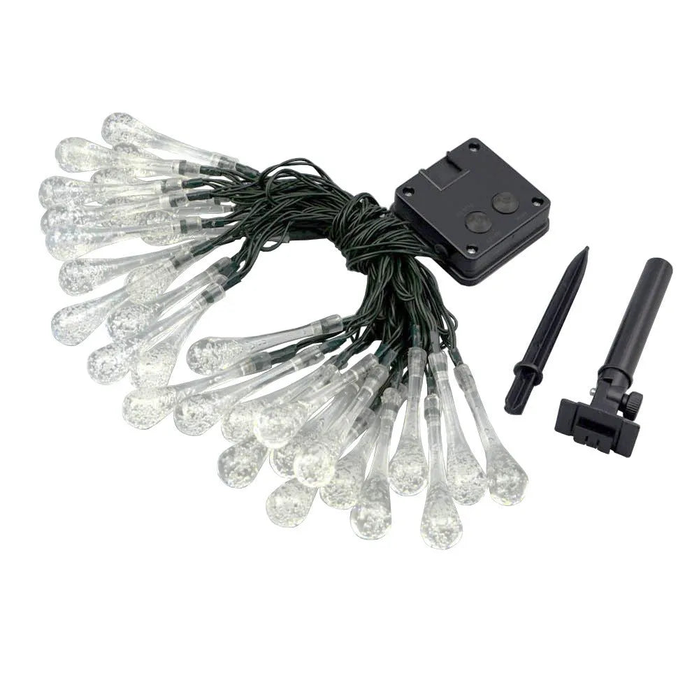 6.5 metre solar LED outdoor string lights with water drop bubble pendants in garden setting