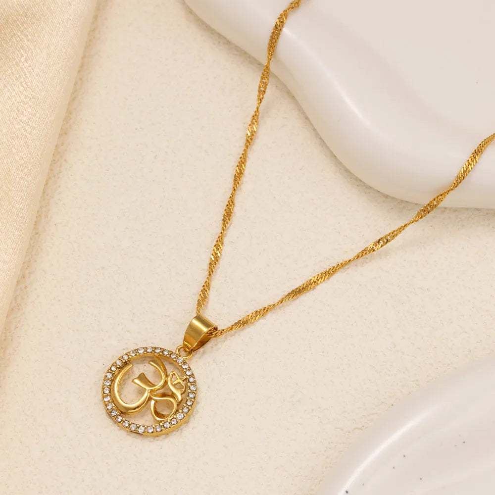 Gold plated copper circular pendant necklace with diamond edge inlay and OM symbol