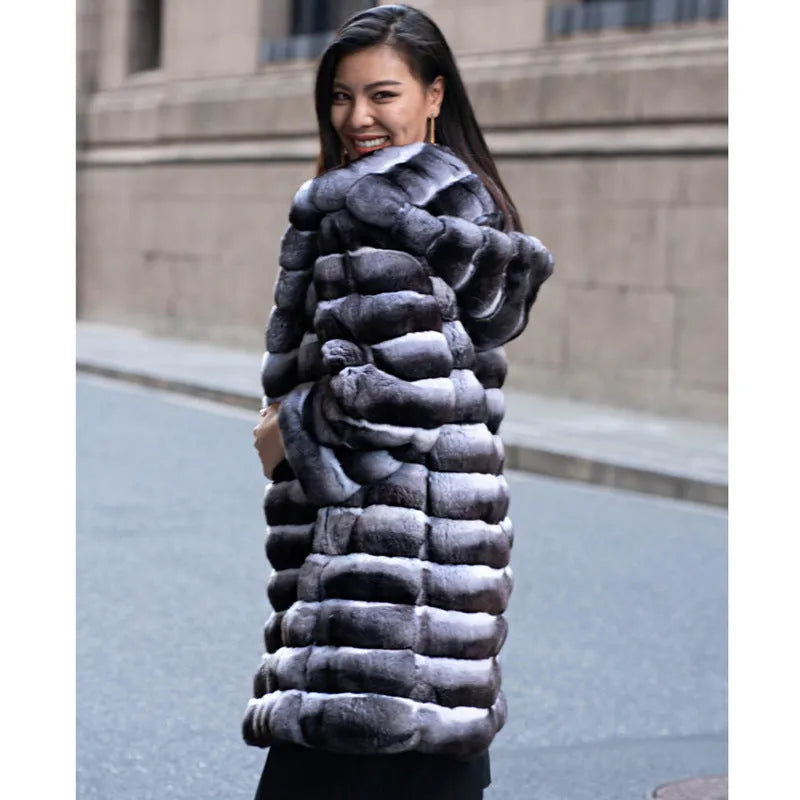 Women's zebra stripe pattern artificial mink faux fur mid-length coat on a hanger.