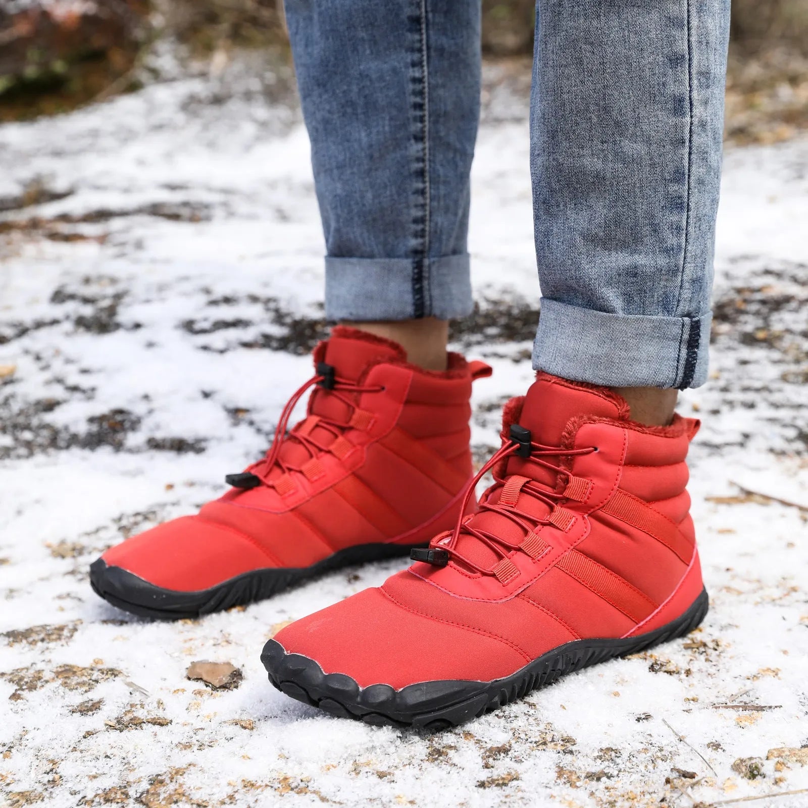 Beige five-finger waterproof snow boots with rubber sole and fleece lining on outdoor ground.