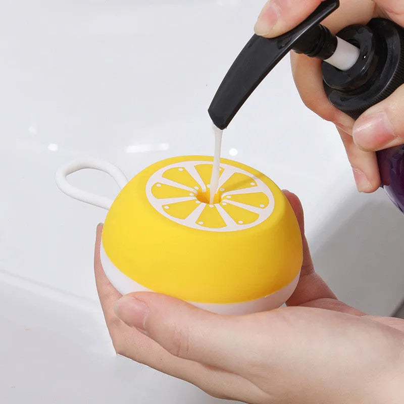 Yellow silicone pet bath brush with 3D massage head for dog and cat grooming during bath time