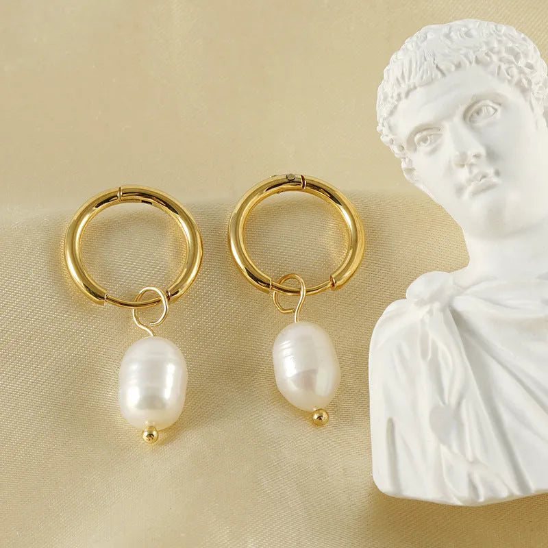 Gold coloured geometric women's earrings with a freshwater pearl, made from stainless steel and titanium steel.