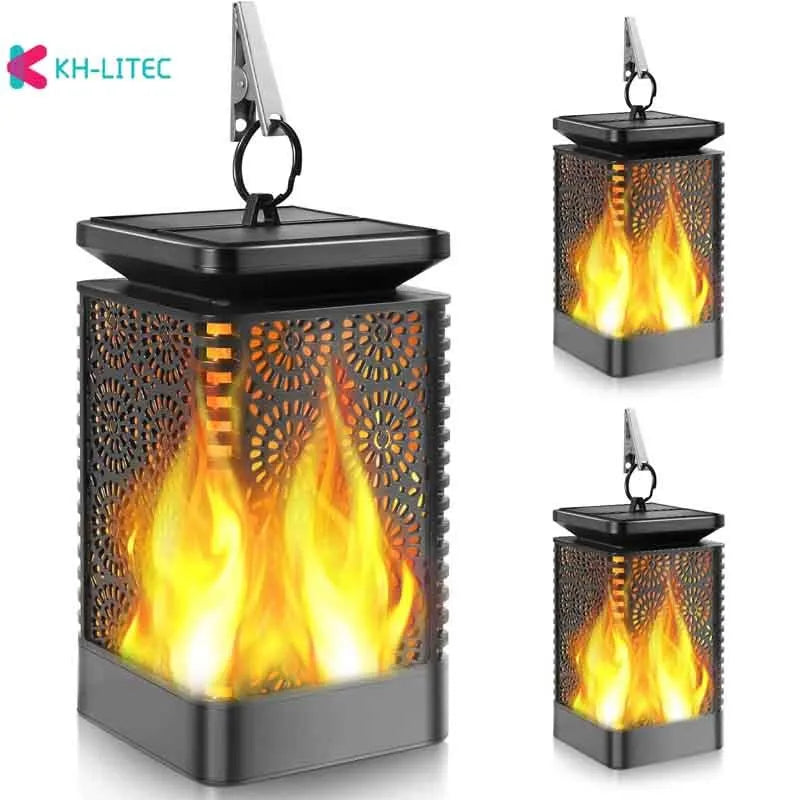Set of four black solar-powered flame torch lights with flickering LED for outdoor garden decoration