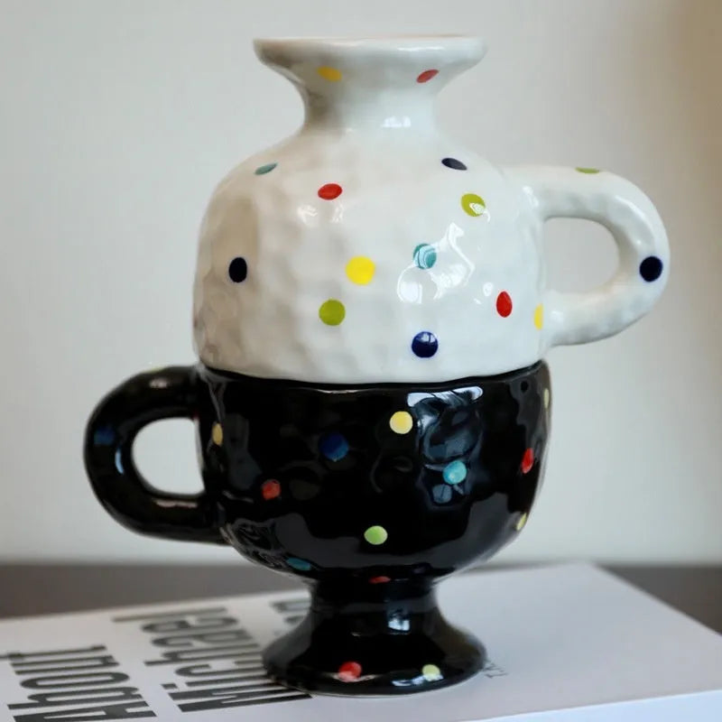 Hand-pinched irregular shaped ceramic mug in a solid colour, showing its unique handmade form.