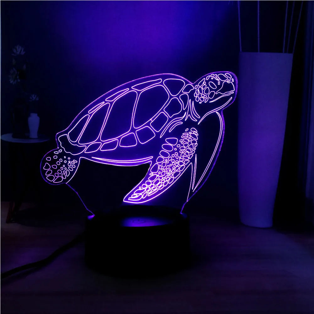 3D transparent acrylic turtle-shaped LED night light glowing with coloured light.