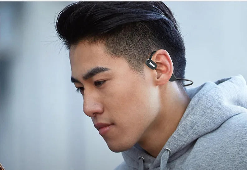 New DYY-5 in-ear wireless Bluetooth headset in black with hanging ear design and stereo earbuds