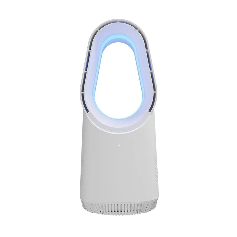 White bladeless tower fan with remote control placed on a desk next to a laptop.
